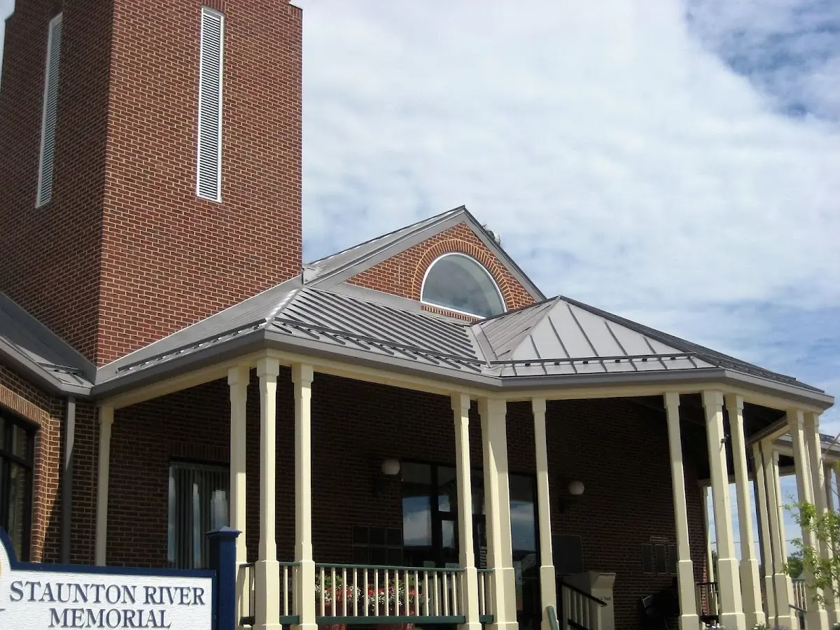 Skilled roofing craftsmen working on a residential roof in Newman